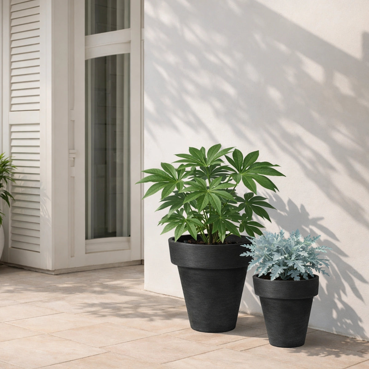 Respect Black 30cm Time Planter – modern black plastic pot for contemporary indoor and outdoor garden styling.