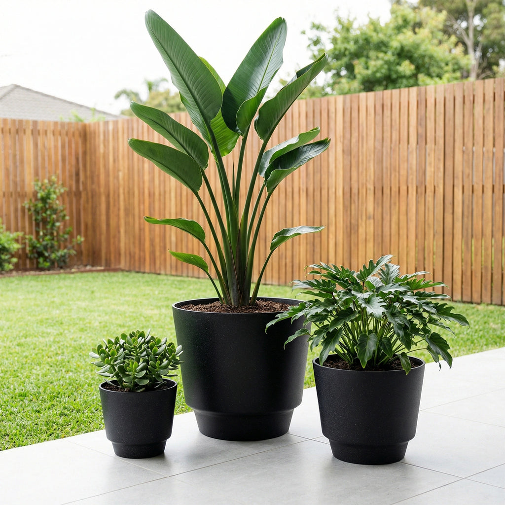 Respect Black 40cm Round Calais Stone Look Self Watering Pot – large stone-effect self watering outdoor planter pot