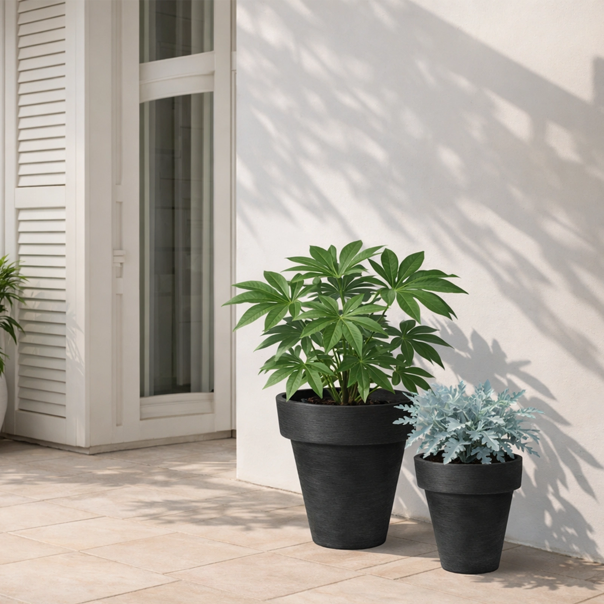 Respect Black 40cm Time Planter with Wheels – large black moveable plastic planter with wheels for patio and balcony.
