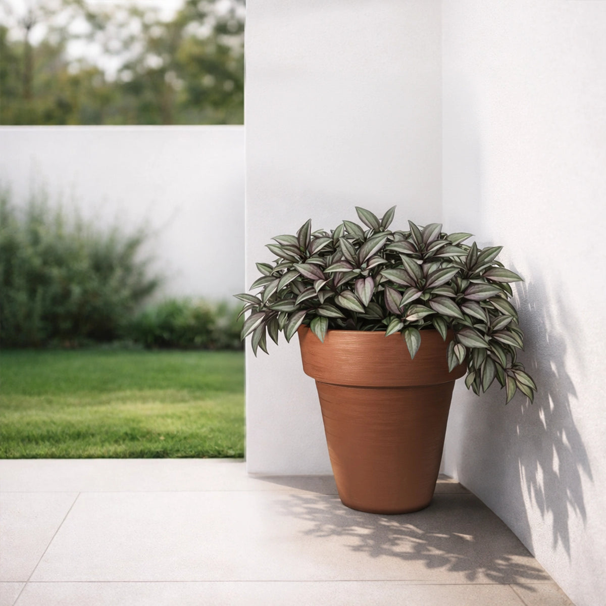 Respect Brown 40cm Terracotta Time Planter with Wheels – large terracotta-look plastic garden planter on wheels.